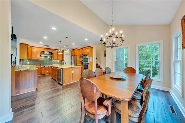 dining area featuring dark wood-style flooring, visible vents, a notable chandelier, wine cooler, and stairs