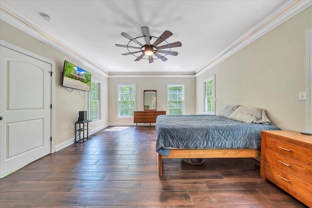 bedroom featuring baseboards, ornamental molding, and wood finished floors