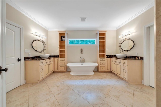 full bath with a sink, tile patterned floors, and ornamental molding