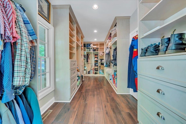 spacious closet featuring visible vents and dark wood-style floors
