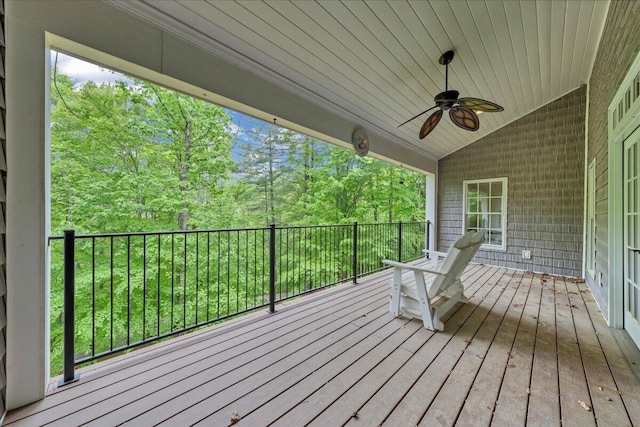 wooden terrace featuring a ceiling fan