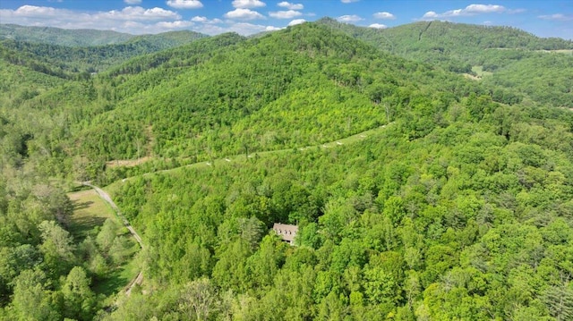 bird's eye view with a mountain view and a wooded view