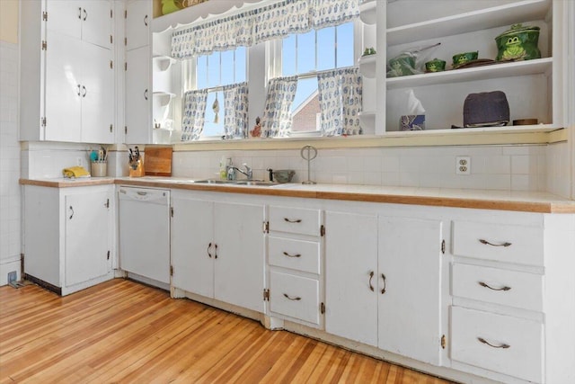 kitchen featuring white dishwasher, open shelves, and white cabinets