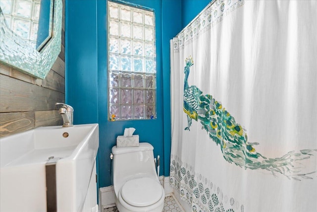 full bathroom featuring toilet