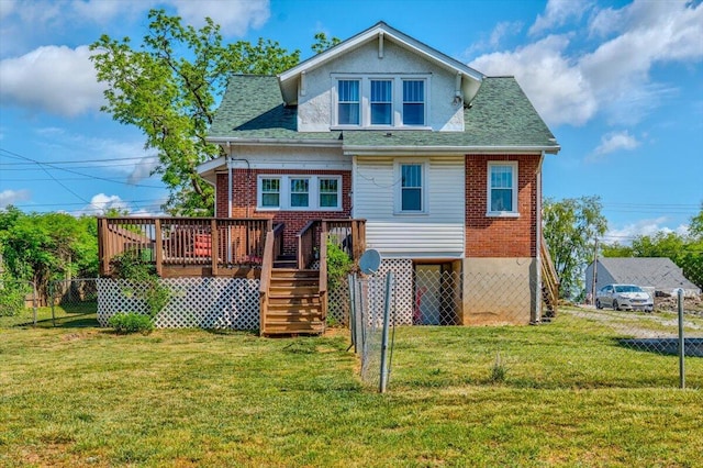rear view of property featuring a wooden deck, stairs, roof with shingles, and brick siding