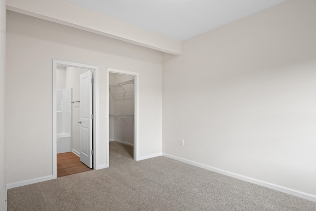 5595 New Pleasant Way, Salem, VA 24153 - unfurnished bedroom featuring carpet flooring, a closet, baseboards, and a spacious closet