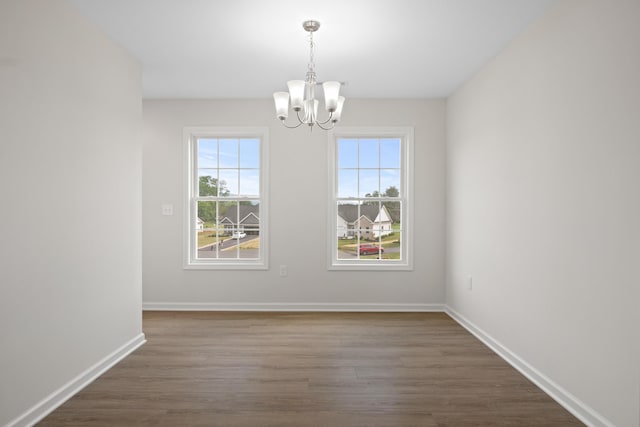 5595 New Pleasant Way, Salem, VA 24153 - unfurnished dining area with baseboards, dark wood-style flooring, and a notable chandelier
