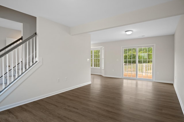 5595 New Pleasant Way, Salem, VA 24153 - unfurnished living room with stairs, baseboards, and dark wood finished floors