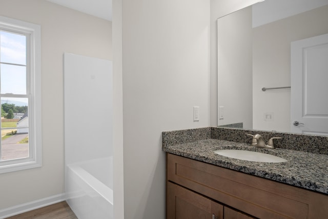 5595 New Pleasant Way, Salem, VA 24153 - full bath with baseboards, vanity, plenty of natural light, and wood finished floors