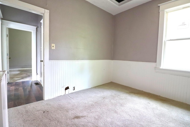 1412 9th St SE, Roanoke, VA 24013 - empty room featuring a wainscoted wall and carpet floors
