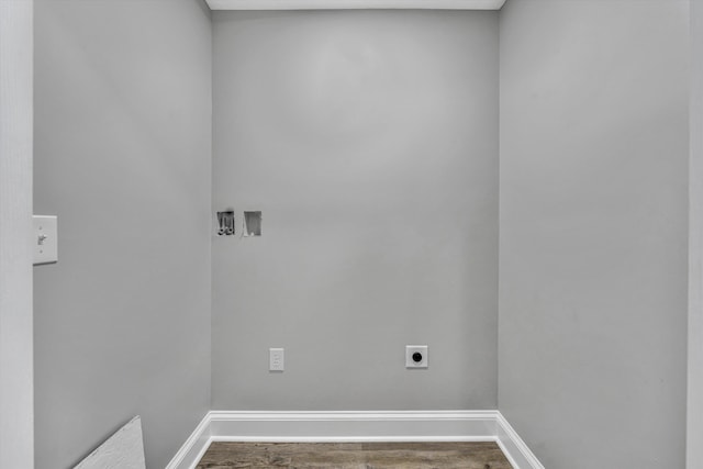 washroom with baseboards, washer hookup, wood finished floors, hookup for an electric dryer, and laundry area