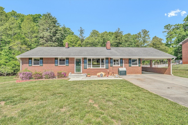 single story home with brick siding, driveway, a front yard, an attached carport, and a chimney