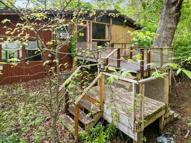 view of side of property with a wooden deck