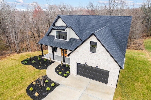 1065 Cedar Fox Ct, Forest, VA 24551 - view of front of house featuring a front lawn, a porch, roof with shingles, and a garage