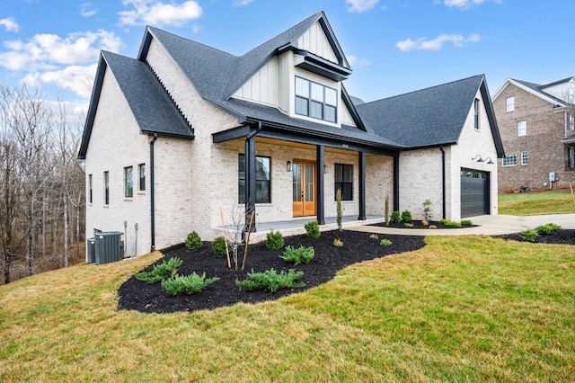 1065 Cedar Fox Ct, Forest, VA 24551 - modern inspired farmhouse with a front lawn, brick siding, covered porch, and a garage