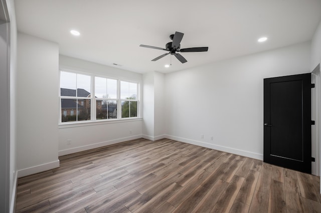 1065 Cedar Fox Ct, Forest, VA 24551 - empty room with wood finished floors, baseboards, ceiling fan, and recessed lighting