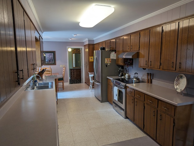 kitchen with a sink, stainless steel appliances, light floors, under cabinet range hood, and light countertops
