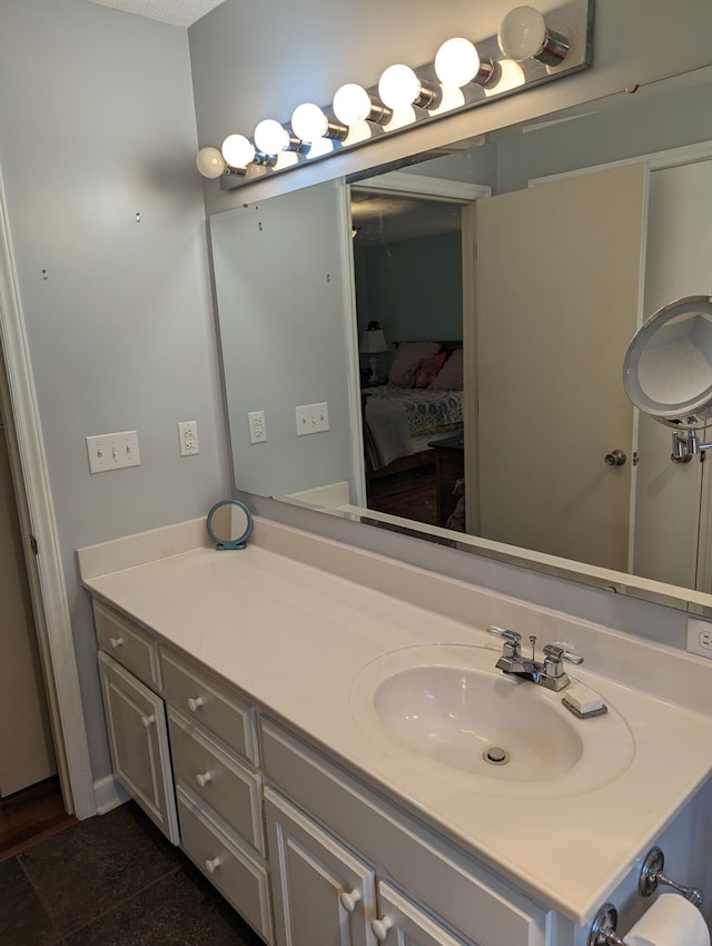 bathroom featuring vanity and connected bathroom