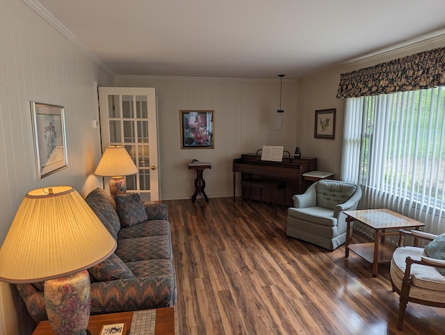 living area featuring crown molding and wood finished floors