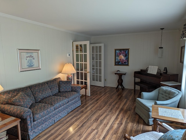 living area featuring baseboards, ornamental molding, french doors, and wood finished floors