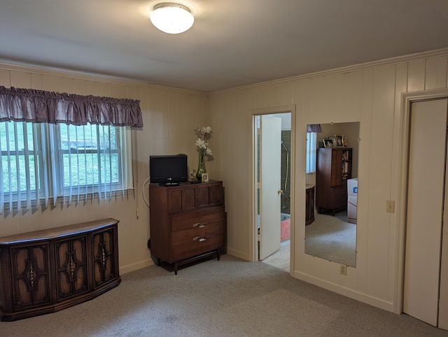 bedroom with carpet and crown molding