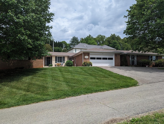 ranch-style house with a front lawn, driveway, brick siding, and a garage