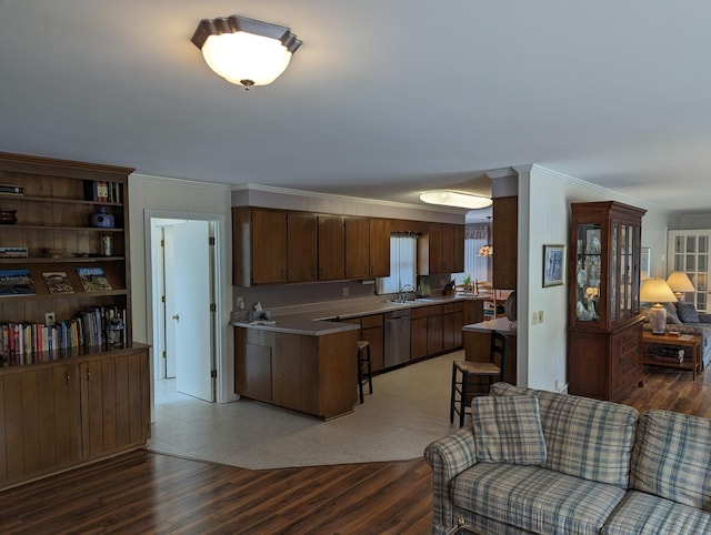 living area with light wood-style flooring and ornamental molding
