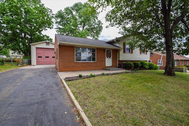 906 Ingleside Ln, Salem, VA 24153 - split level home with driveway, brick siding, an outbuilding, and an attached garage