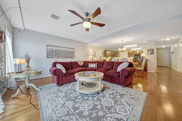 1100 Celebration Ave Unit 405, Moneta, VA 24121 - living area featuring a ceiling fan, wood finished floors, baseboards, and a chandelier