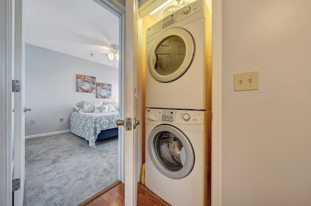 1100 Celebration Ave Unit 405, Moneta, VA 24121 - clothes washing area with stacked washer / drying machine, a ceiling fan, carpet flooring, and baseboards