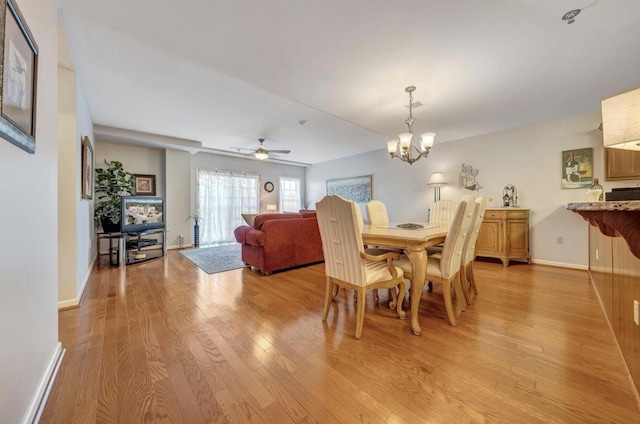 1100 Celebration Ave Unit 405, Moneta, VA 24121 - dining room with light wood finished floors, a chandelier, baseboards, and ceiling fan