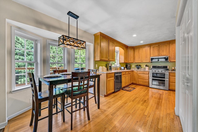 4848 Hickory Ridge Ct, Roanoke, VA 24018 - kitchen with appliances with stainless steel finishes, light countertops, light wood finished floors, healthy amount of natural light, and recessed lighting