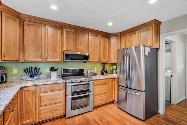 4848 Hickory Ridge Ct, Roanoke, VA 24018 - kitchen featuring stainless steel appliances, light stone countertops, light wood-type flooring, recessed lighting, and brown cabinetry