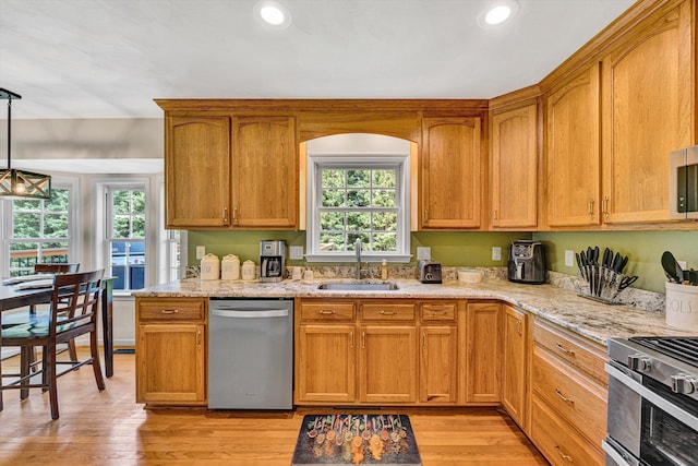 4848 Hickory Ridge Ct, Roanoke, VA 24018 - kitchen featuring stainless steel appliances, a sink, light stone counters, light wood finished floors, and recessed lighting