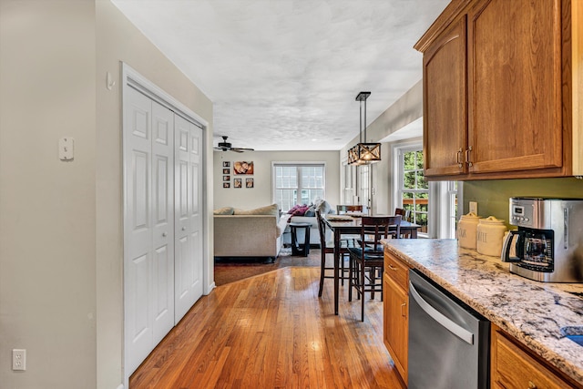 4848 Hickory Ridge Ct, Roanoke, VA 24018 - kitchen with stainless steel dishwasher, brown cabinets, hardwood / wood-style floors, and open floor plan