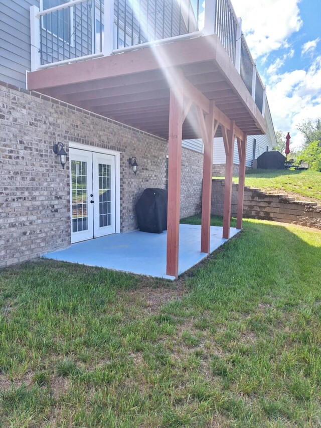 view of patio / terrace featuring french doors and a balcony