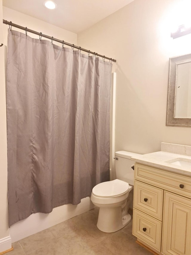 bathroom with toilet, shower / bath combo, tile patterned floors, vanity, and recessed lighting