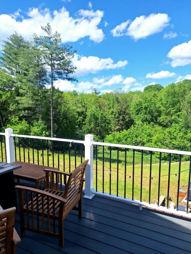 wooden terrace with a forest view