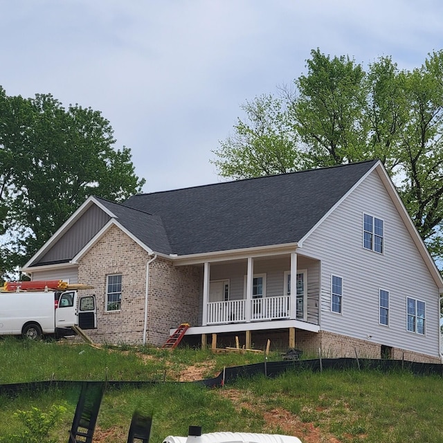 5591 Old Grove Ln, Salem, VA 24153 - view of front of property featuring roof with shingles, brick siding, and covered porch