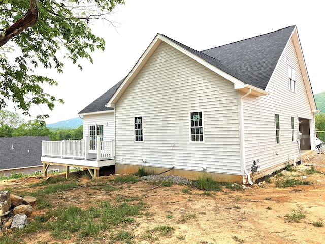 5591 Old Grove Ln, Salem, VA 24153 - rear view of house featuring roof with shingles and a deck with mountain view