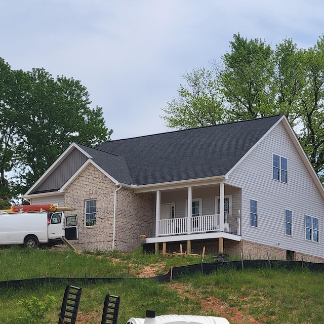 5591 Old Grove Ln, Salem, VA 24153 - view of front of home featuring a shingled roof, brick siding, and covered porch