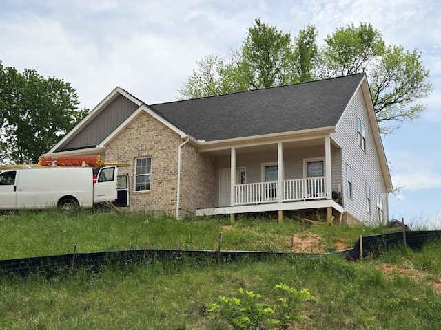 5591 Old Grove Ln, Salem, VA 24153 - view of front of property with a shingled roof, brick siding, and covered porch