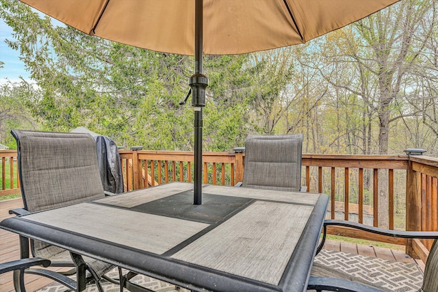 deck with outdoor dining area
