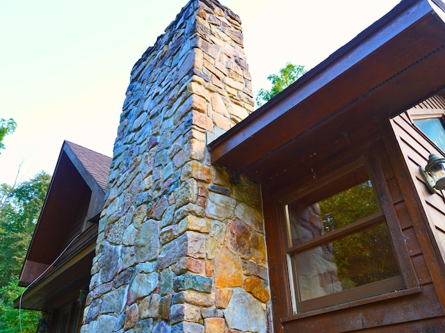 195 Lost Spring Ln, Lexington, VA 24450 - details with stone siding, a shingled roof, and a chimney