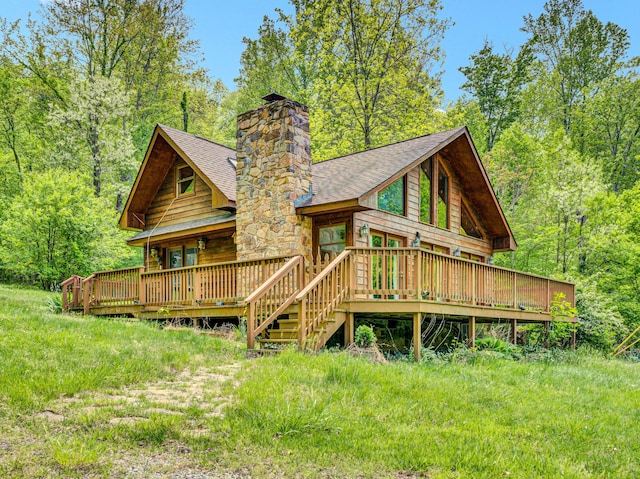 195 Lost Spring Ln, Lexington, VA 24450 - rear view of house with roof with shingles, a wooden deck, a wooded view, and a chimney