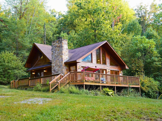 195 Lost Spring Ln, Lexington, VA 24450 - back of property featuring a wooded view, a wooden deck, a chimney, and a lawn
