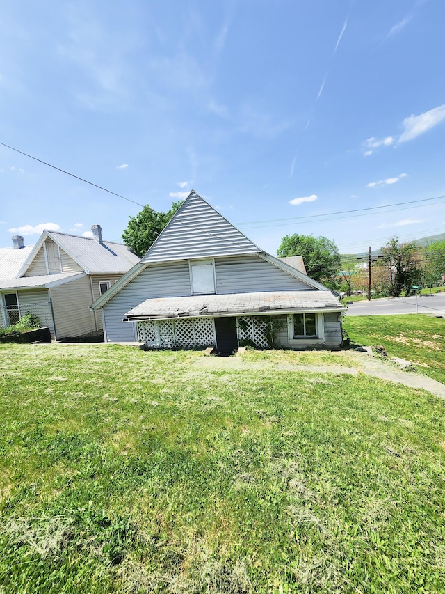 view of home's exterior featuring a yard