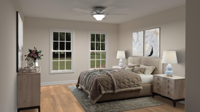 bedroom featuring wood finished floors, baseboards, and ceiling fan