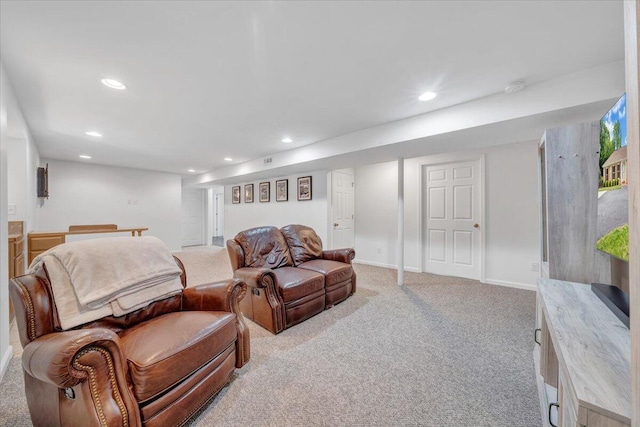 living room featuring recessed lighting, light colored carpet, and baseboards