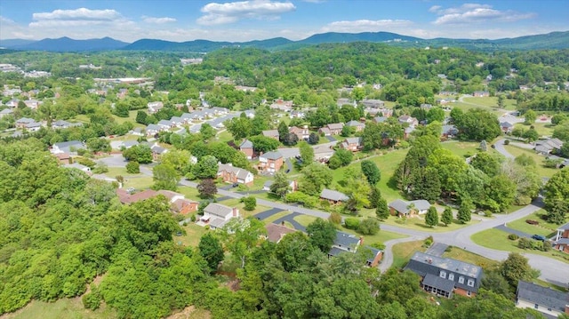 aerial view of property's location featuring mountains